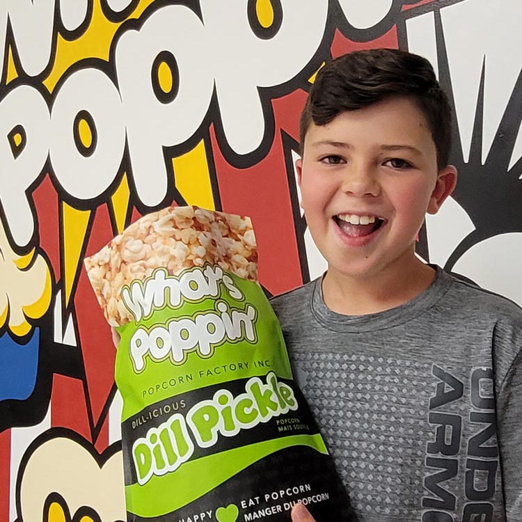 Child with Dill Pickle Popcorn Bag